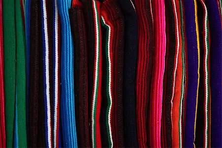 Woven rugs with color strips are piled Stock Photo - Budget Royalty-Free & Subscription, Code: 400-06854595