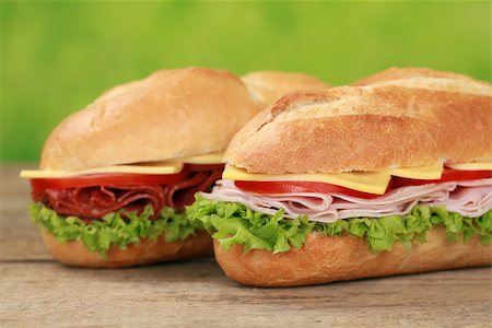 simsearch:400-06421213,k - Sub Sandwiches with salami, ham, cheese, tomatoes and lettuce Foto de stock - Super Valor sin royalties y Suscripción, Código: 400-06854862