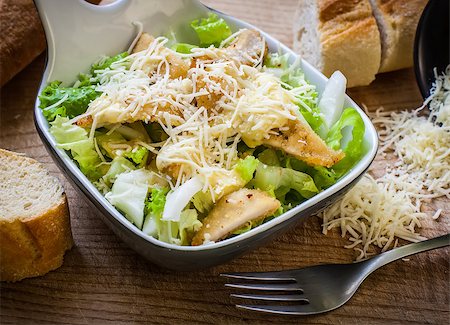 fresh caesar salad on bowl with parmesan cheese Stock Photo - Budget Royalty-Free & Subscription, Code: 400-06854874