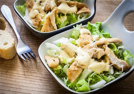 fresh caesar salad on bowl with parmesan cheese Stock Photo - Budget Royalty-Free & Subscription, Code: 400-06854870