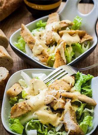 fresh caesar salad on bowl with parmesan cheese Stock Photo - Budget Royalty-Free & Subscription, Code: 400-06854871