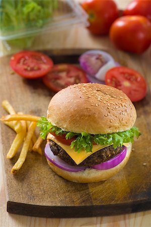 burger with fast food items and materials on the background Stock Photo - Budget Royalty-Free & Subscription, Code: 400-06855250