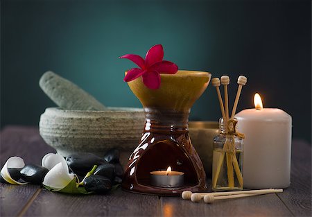 flame lily - tropical frangipani spa health treatment with aroma therapy and hot stones, shot with ambient lights Stock Photo - Budget Royalty-Free & Subscription, Code: 400-06855264