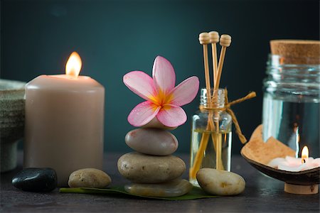 essence - tropical frangipani spa health treatment with aroma therapy and hot stones, shot with ambient lights Stock Photo - Budget Royalty-Free & Subscription, Code: 400-06855267
