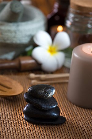 flame lily - hot stone massage with spa treatment items on the background Stock Photo - Budget Royalty-Free & Subscription, Code: 400-06855269