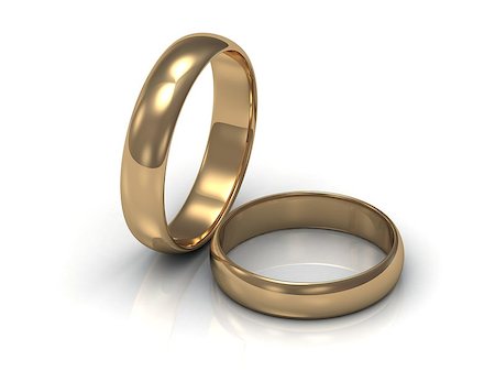 simsearch:400-05361582,k - Gold ring near the ring. 2 wedding rings on a white background Stock Photo - Budget Royalty-Free & Subscription, Code: 400-06855567