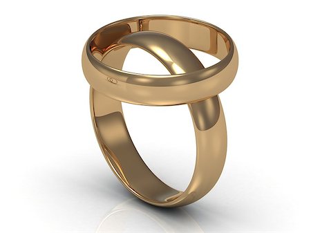 simsearch:400-06061555,k - 2 Gold wedding rings. Ring on the ring on a white background Photographie de stock - Aubaine LD & Abonnement, Code: 400-06855568