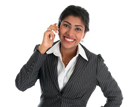Indian woman talking on phone. Smart Indian business woman on the phone smiling happy isolated on white background. Beautiful Asian female model. Stock Photo - Budget Royalty-Free & Subscription, Code: 400-06856119