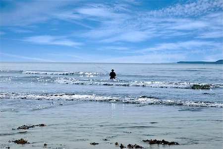 simsearch:400-06852239,k - lone man fishing in the river Shannon estuary waves in Ballybunion county Kerry Ireland Photographie de stock - Aubaine LD & Abonnement, Code: 400-06856476