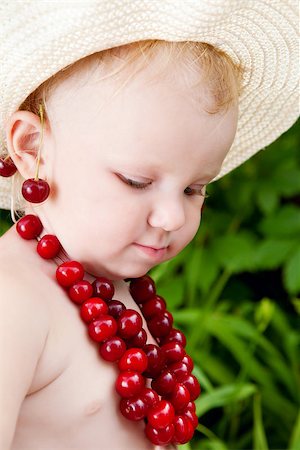 girl and cherries in green leaves background Stock Photo - Budget Royalty-Free & Subscription, Code: 400-06857494