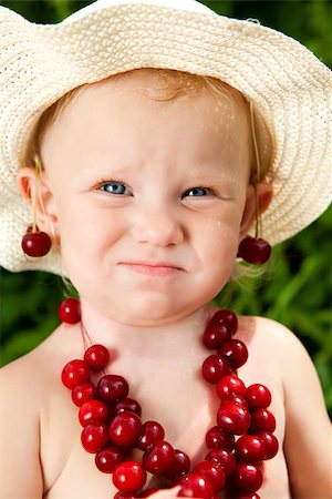 portrait od the child with cherry beads Stock Photo - Budget Royalty-Free & Subscription, Code: 400-06857495