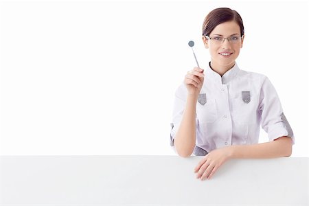 female with dental tools at work - Dentist on white background Stock Photo - Budget Royalty-Free & Subscription, Code: 400-06857674