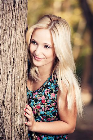 peeping fashion - Outdoor portrait of a beautiful young girl smiling Stock Photo - Budget Royalty-Free & Subscription, Code: 400-06857888