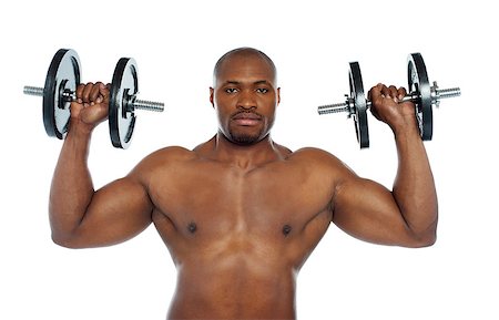 simsearch:400-06859184,k - Shirtless african male holding dumbbells over his shoulders. Exercising Stockbilder - Microstock & Abonnement, Bildnummer: 400-06859185