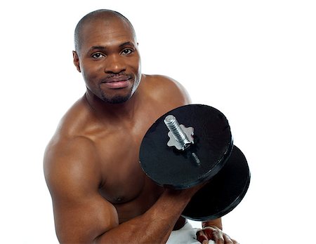 simsearch:400-06859184,k - Powerful muscular young man lifting weights. Smiling at camera Stockbilder - Microstock & Abonnement, Bildnummer: 400-06859189