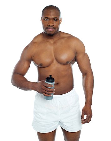 simsearch:400-06859184,k - Athlete posing with health drink bottle isolated over white Stockbilder - Microstock & Abonnement, Bildnummer: 400-06859191