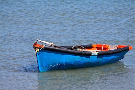 simsearch:400-04534228,k - Anchored wooden fishing boat with reflection in water Foto de stock - Super Valor sin royalties y Suscripción, Código: 400-06859516