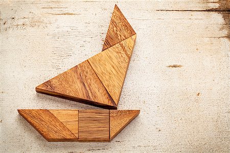 simsearch:400-07774007,k - abstract picture of a sailing boat built from seven tangram wooden pieces over a rustic white painted barn wood Foto de stock - Royalty-Free Super Valor e Assinatura, Número: 400-06859523