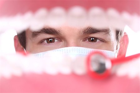 Dentist Working Inside a Patient Mouth Fotografie stock - Microstock e Abbonamento, Codice: 400-06859575