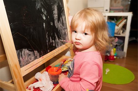 pretty baby girl painting at an easel, at home Stock Photo - Budget Royalty-Free & Subscription, Code: 400-06852211