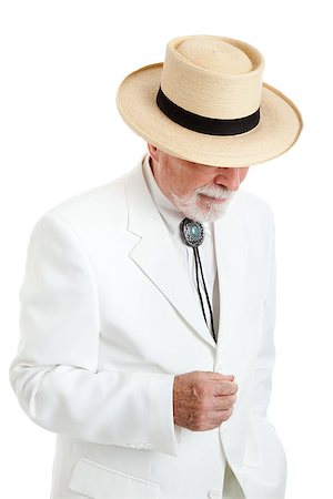 simsearch:400-08040653,k - Elegantly dressed senior man from the American South or the Islands, wearing a white suit, string tie, and straw Panama hat.  Isolated on white. Stock Photo - Budget Royalty-Free & Subscription, Code: 400-06852688