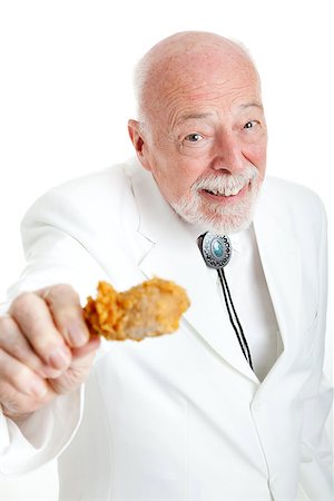 simsearch:400-08040653,k - Handsome southern senior gentleman, Kentucky colonel (a generic title), eating a fried chicken leg.  White background. Stock Photo - Budget Royalty-Free & Subscription, Code: 400-06852691