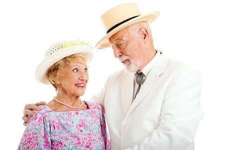 simsearch:400-08040653,k - Handsome senior gentleman flirting with a beautiful senior lady.  Isolated on white. Stock Photo - Budget Royalty-Free & Subscription, Code: 400-06852692