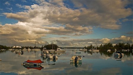 Boats reflecting on a calm sea, early in the mrning Stockbilder - Microstock & Abonnement, Bildnummer: 400-06853074