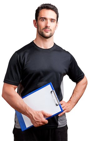 simsearch:400-06914161,k - Personal Trainer, with a pad in his hand, isolated in white Photographie de stock - Aubaine LD & Abonnement, Code: 400-06853086