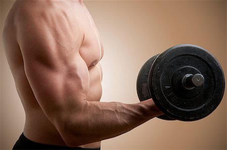 ruigsantos (artist) - Personal Trainer doing standing dumbbell curls for training his biceps Fotografie stock - Microstock e Abbonamento, Codice: 400-06853094