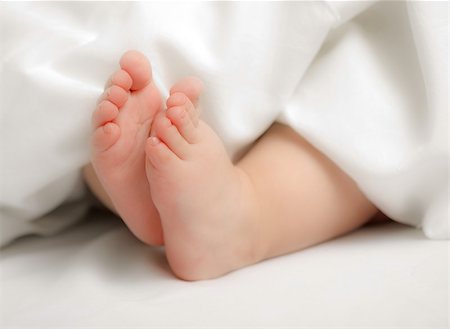 Baby boy's small feet; soft focus Stock Photo - Budget Royalty-Free & Subscription, Code: 400-06853385