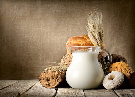 Milk and bread on the background of the canvas Stock Photo - Budget Royalty-Free & Subscription, Code: 400-06853827