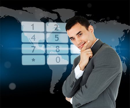 Businessman standing in front of number pad hologram on world map Stock Photo - Budget Royalty-Free & Subscription, Code: 400-06864053
