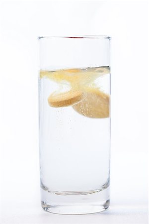 dissolving - Vitamin tablet dissoving in glass of water Stock Photo - Budget Royalty-Free & Subscription, Code: 400-06864416