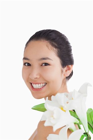 fresh-faced - Natural beauty with lilies on white background Stock Photo - Budget Royalty-Free & Subscription, Code: 400-06864594