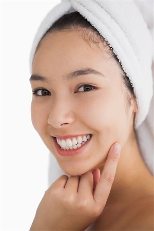 fresh-faced - Woman wearing a towel for her hair while smiling Stock Photo - Budget Royalty-Free & Subscription, Code: 400-06864599