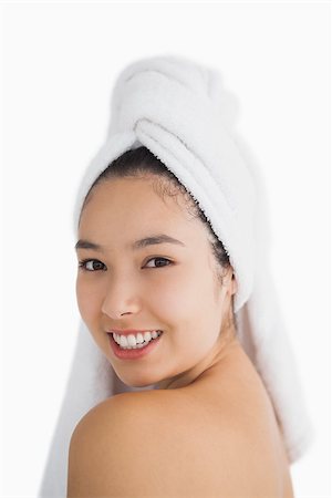 fresh-faced - Black haired woman wearing a hair towel while smiling Stock Photo - Budget Royalty-Free & Subscription, Code: 400-06864600