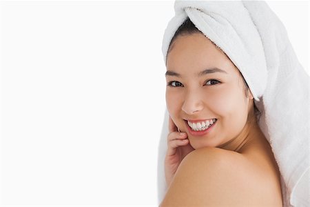 fresh-faced - Woman wearing a towel while touching her skin Stock Photo - Budget Royalty-Free & Subscription, Code: 400-06864603