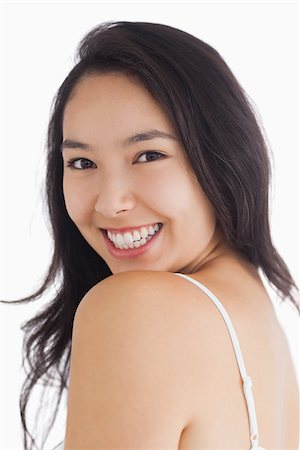 fresh-faced - Young woman smiling at camera while looking natural Stock Photo - Budget Royalty-Free & Subscription, Code: 400-06864614