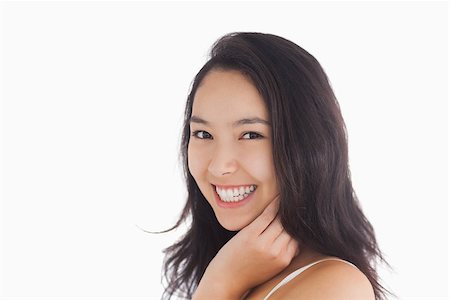 fresh-faced - Natural beauty smiling while touching her face Stock Photo - Budget Royalty-Free & Subscription, Code: 400-06864613