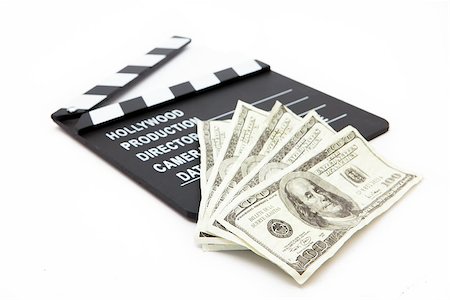 film making - Film slate and money lying against white background Stock Photo - Budget Royalty-Free & Subscription, Code: 400-06864771