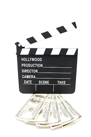 film making - Fanned out dollar bills under film slate on white background Stock Photo - Budget Royalty-Free & Subscription, Code: 400-06864773