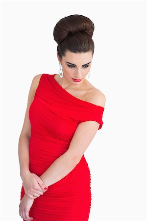 Brunette woman with red dress looking glamorous Stock Photo - Budget Royalty-Free & Subscription, Code: 400-06865064