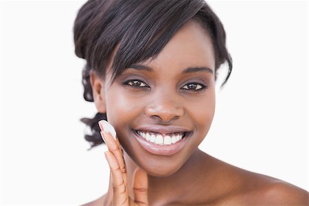 Smiling woman applying face cream Stock Photo - Budget Royalty-Free & Subscription, Code: 400-06865158