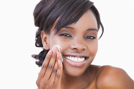 Woman using skin cream on her face Stock Photo - Budget Royalty-Free & Subscription, Code: 400-06865159