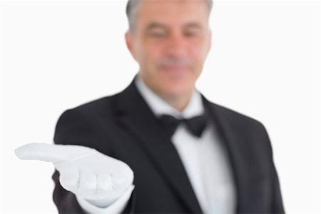 Waiter showing his opened hand to the camera Stock Photo - Budget Royalty-Free & Subscription, Code: 400-06865446