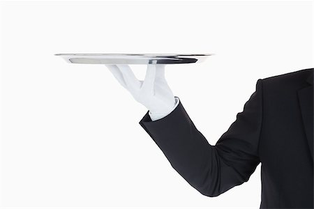 silver service - Hand with gloves holding a silver tray in front of camera Stock Photo - Budget Royalty-Free & Subscription, Code: 400-06865467