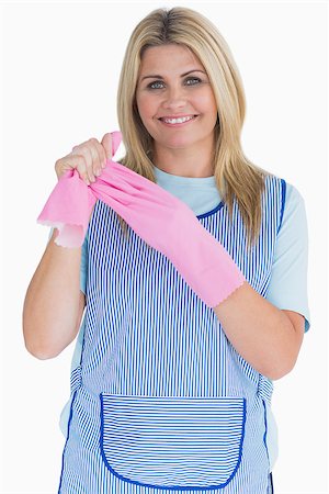 simsearch:400-06866097,k - Cleaner woman removing pink gloves in the white background Foto de stock - Super Valor sin royalties y Suscripción, Código: 400-06866077