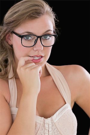 Woman wearing glasses chewing on finger Stock Photo - Budget Royalty-Free & Subscription, Code: 400-06866206
