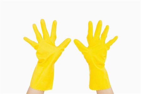 rubber hand gloves - Outstretched hands wearing yellow rubber gloves Stock Photo - Budget Royalty-Free & Subscription, Code: 400-06866378